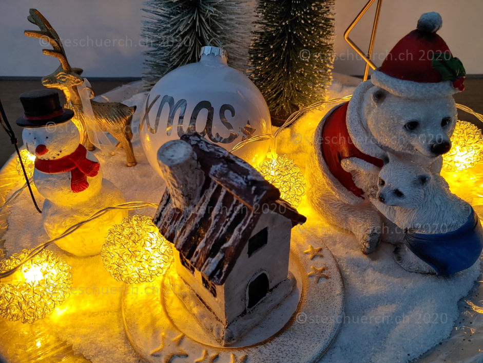Christmas decoration with snow figures and lights.