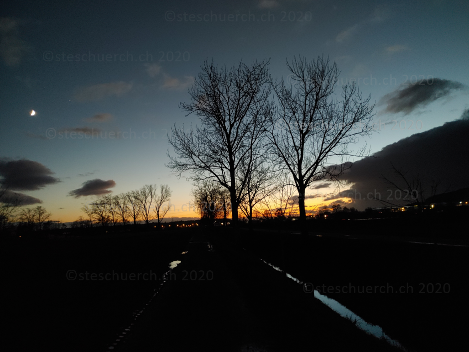 Well advanced dusk with rising clouds